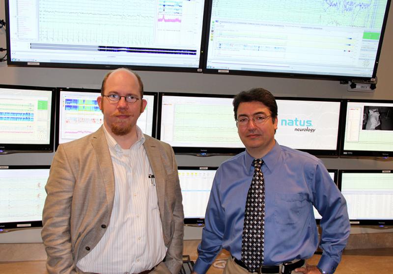 Drs. Burghardt and Kassab in front of the epilepsy equipment Photo of Drs. Burghardt and Kassab in front of the epilepsy equipment
